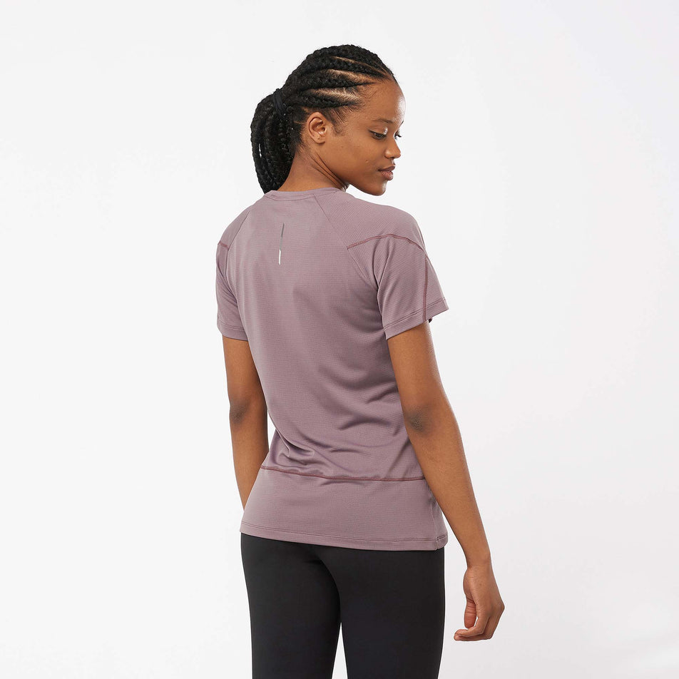 Back view of a model wearing a Salomon Women's Cross Run Short Sleeve T-Shirt in the Moonscape colourway (7999423840418)