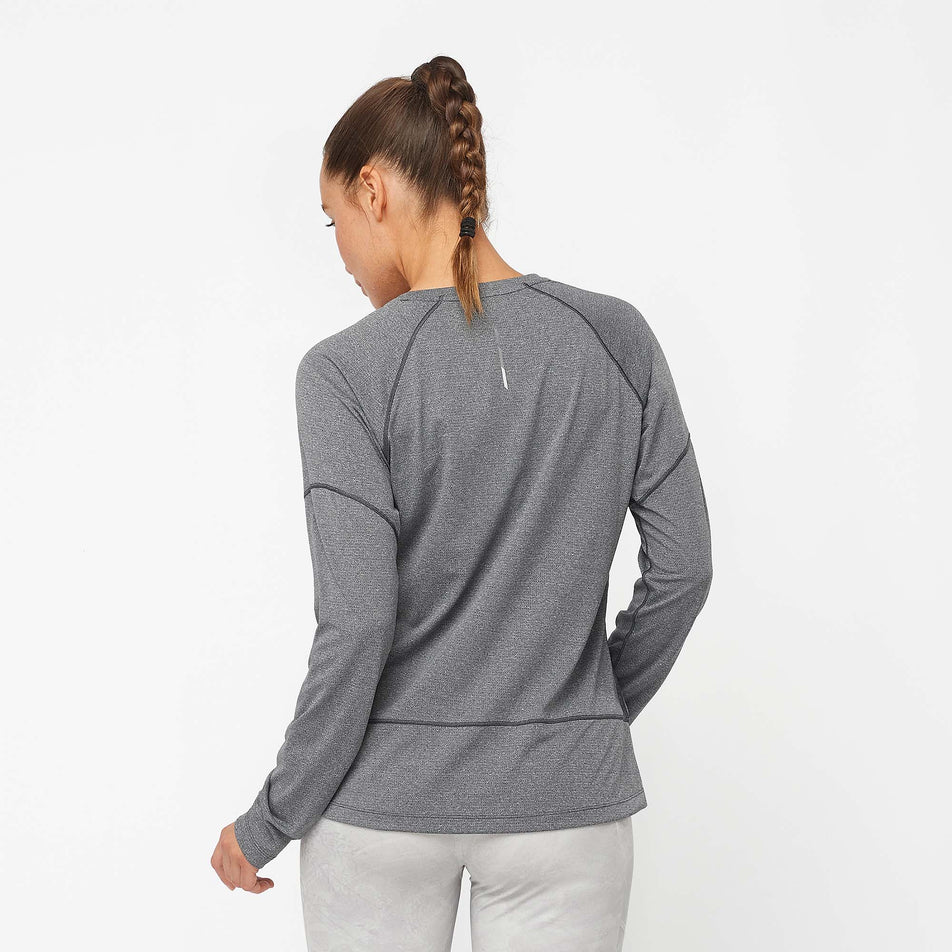 Back view of a model wearing a Salomon Women's Cross Run Long Sleeve T-Shirt in the Deep Black/Heather colourway (7999065981090)
