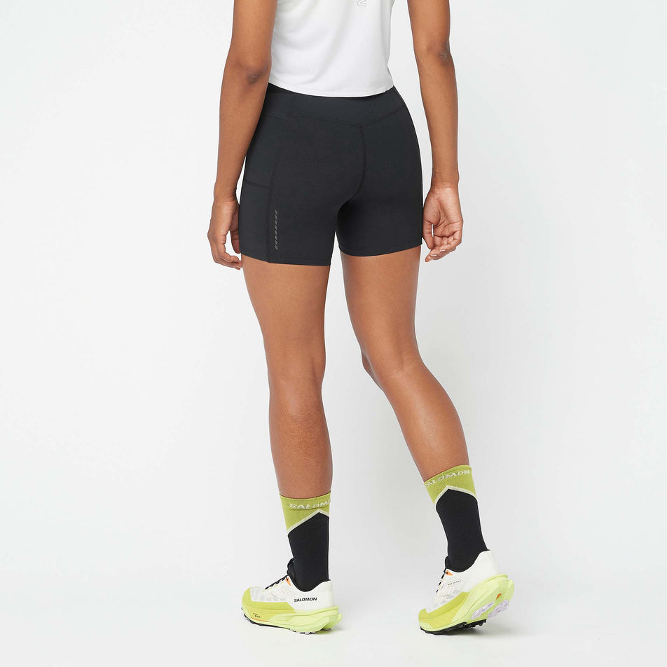 Back view of a model wearing a pair of Salomon Women's Sense Aero 5
