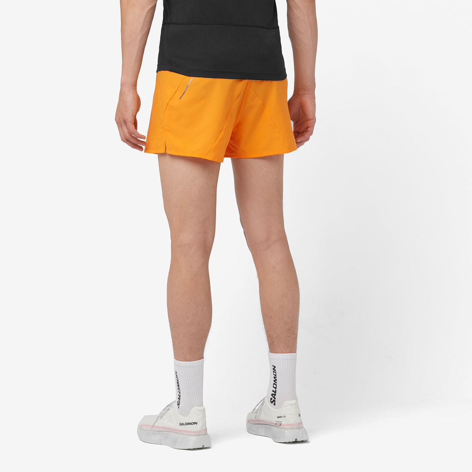 Back view of a model wearing a pair of Salomon Men's Cross 3