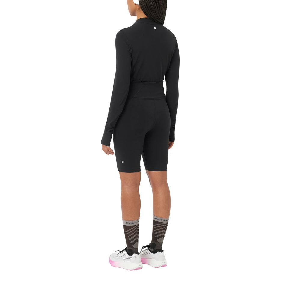 Back view of a model wearing the Salomon Women's SHAKEout BLISS 8