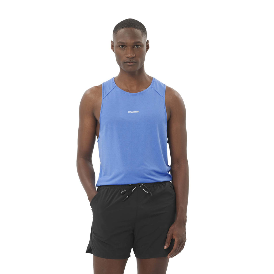 Front view of a model wearing the Salomon Men's SHKout Core Tank in the Ultramarine colourway. (8577973059746)