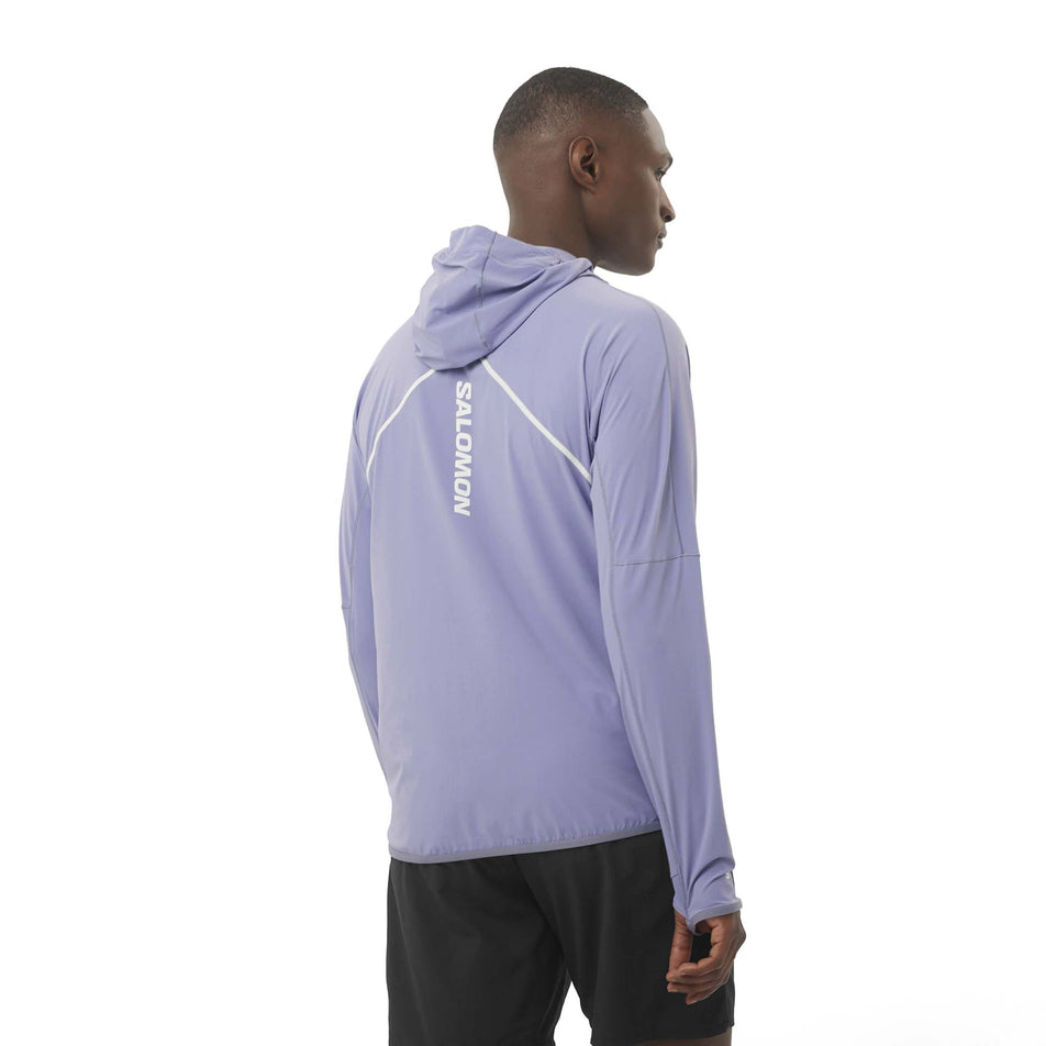 Back view of a model wearing the Salomon Men's Sense Aero Hybrid Midlayer Jacket with Hood in the Blue Granite colourway. (8575574245538)