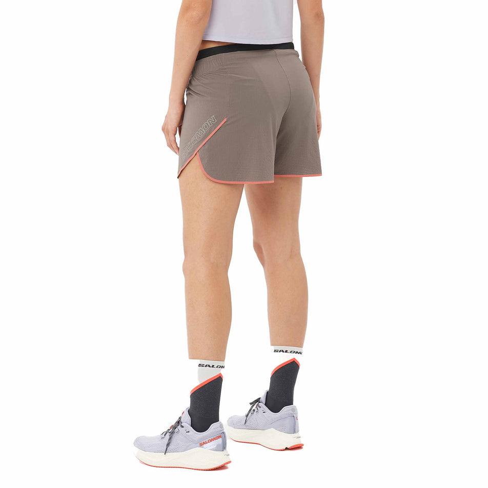 Back view of a model wearing the Salomon Women's Sense Aero 5