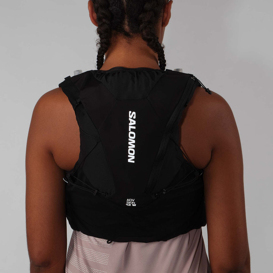 Back view of model wearing the Salomon Women's ADV Skin 12 Set Running Vest in the Black/Asphalt colourway.