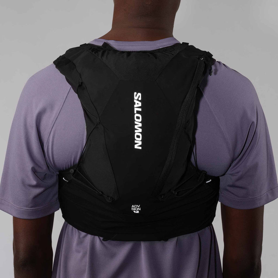 Back view of a model wearing the Salomon Unisex ADV Skin 12 Running Vest in the Black colourway.