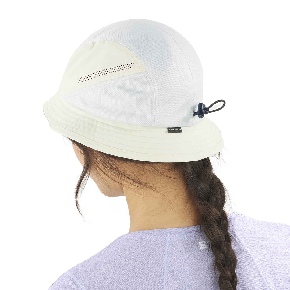 Back view of a model wearing the Salomon Unisex SHKout Bucket Hat in the Icicle colourway. (8577880490146)