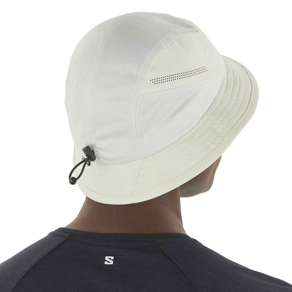 Back view of a model wearing the Salomon Unisex SHKout Bucket Hat in the Icicle colourway. (8577880490146)