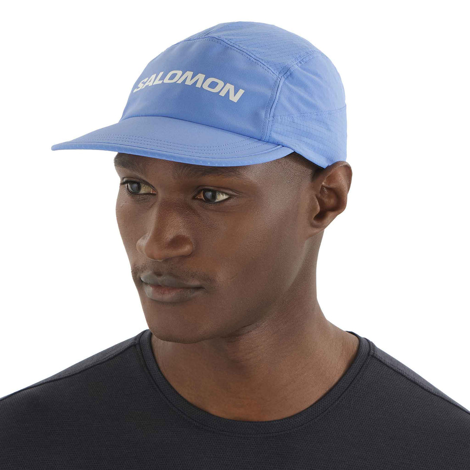 Front view of a model wearing the Salomon Unisex Sense Aero Cap in the Ultramarine colourway. (8577890877602)