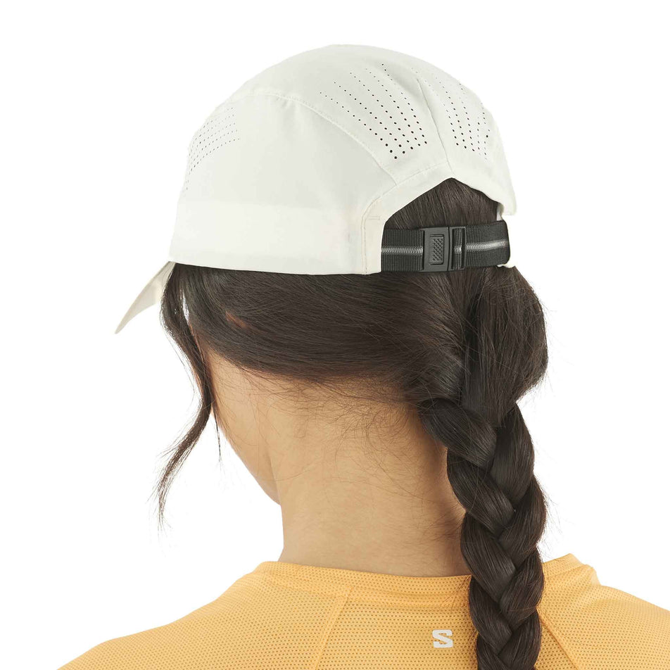 Back view of a model wearing the Salomon Unisex SHKout Cap in the Icicle colourway. (8575956058274)