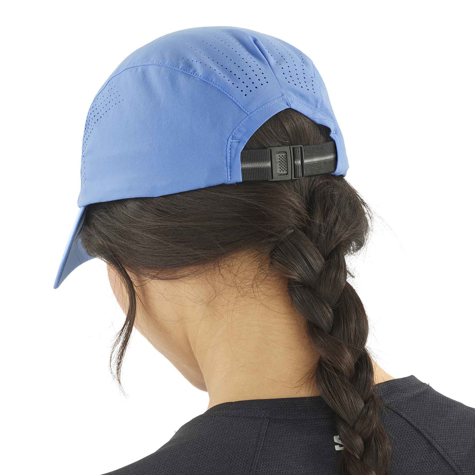 Back view of a model wearing the Salomon Unisex SHKout Cap in the Ultramarine colourway. (8577916829858)