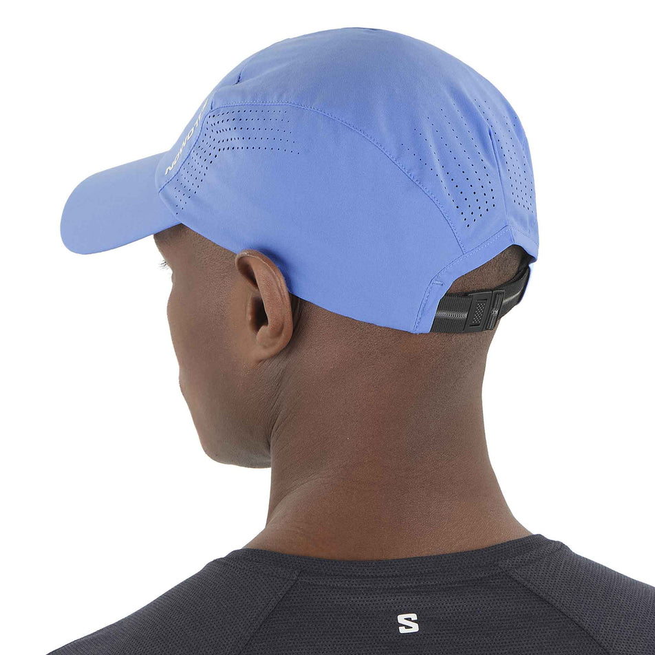 Back view of a model wearing the Salomon Unisex SHKout Cap in the Ultramarine colourway. (8577916829858)