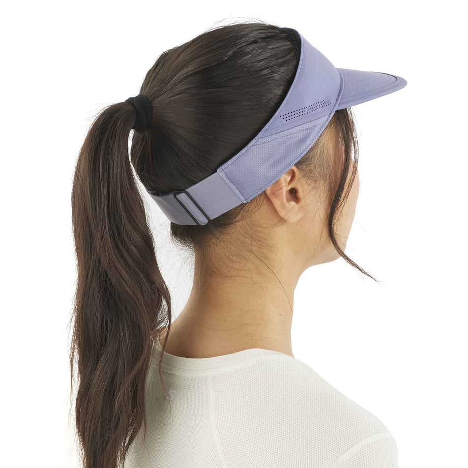Back view of a model wearing the Salomon Unisex SHKout Visor in the Blue Granite colourway. (8577932624034)