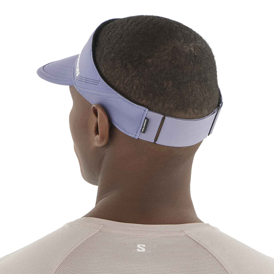 Back view of a model wearing the Salomon Unisex SHKout Visor in the Blue Granite colourway. (8577932624034)