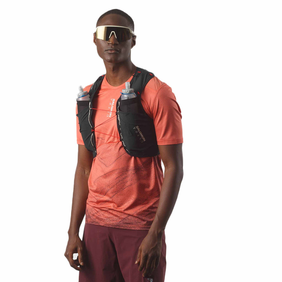 Front view of a model wearing the Salomon Unisex S/LAB Ultra 10 Running Vest with flasks included in the Black colourway. (8575903563938)