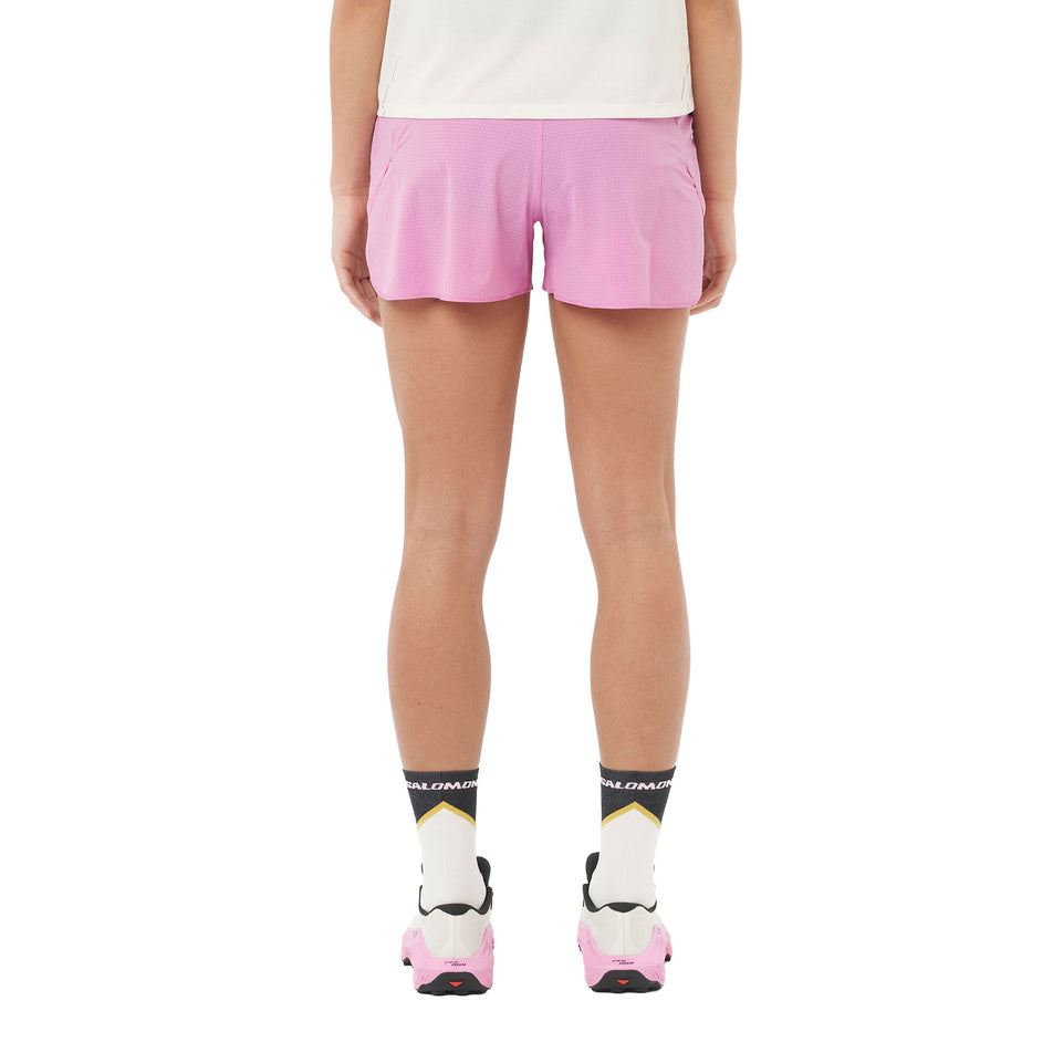 Back view of a model wearing the Salomon Women's Sense Aero 3