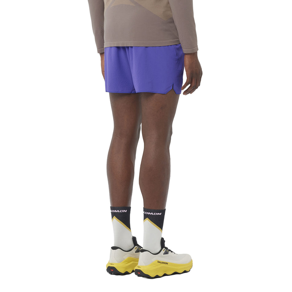 Back view of a model wearing the Salomon Men's Sense Aero 5'' Shorts in the Liberty colourway. (8736794804386)