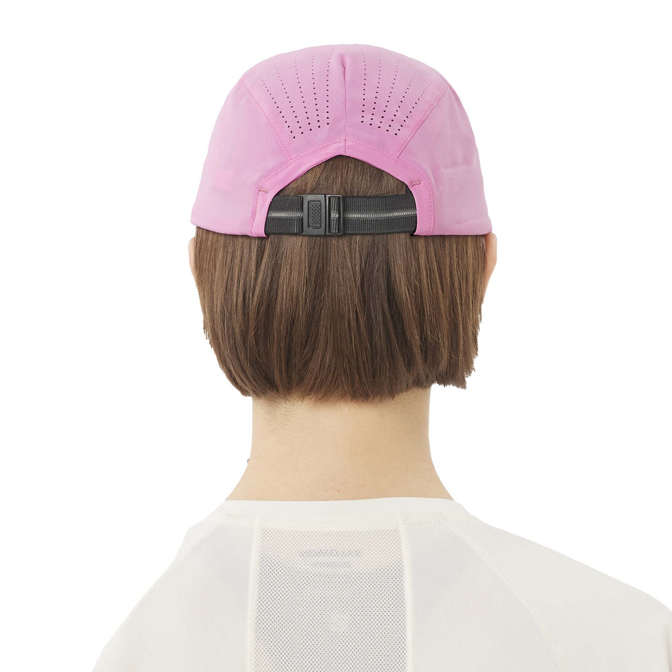 Back view of a model wearing the Salomon Unisex SHAKEout Cap in the Cyclamen colourway. (8738170667170)