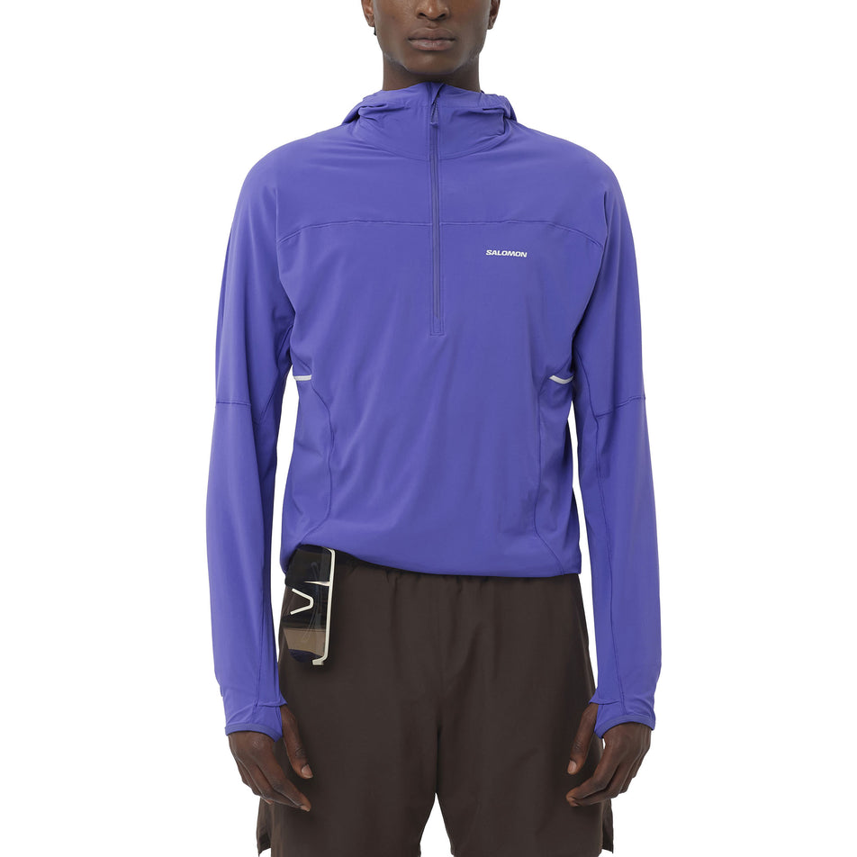Front view of a model wearing the Salomon Men's Sense Aero Hybrid Midlayer Jacket with Hood in the Liberty colourway. (8736774226082)