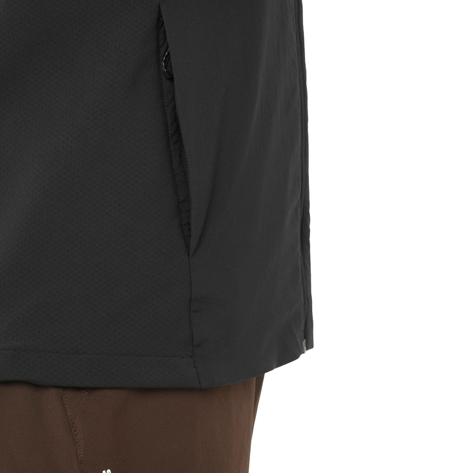 The zip pocket on the side of the Salomon Women's Mountain Flex Hybrid Running Vest in the Deep Black colourway. (8781884653730)