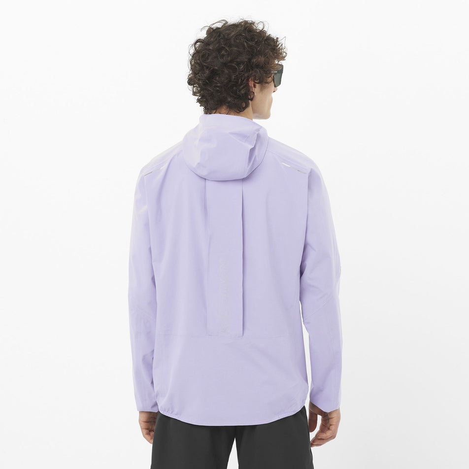 Back view of a model wearing the Salomon Men's Bonatti Trail Shell Jacket in the Cosmic Sky colourway. (8577950548130)