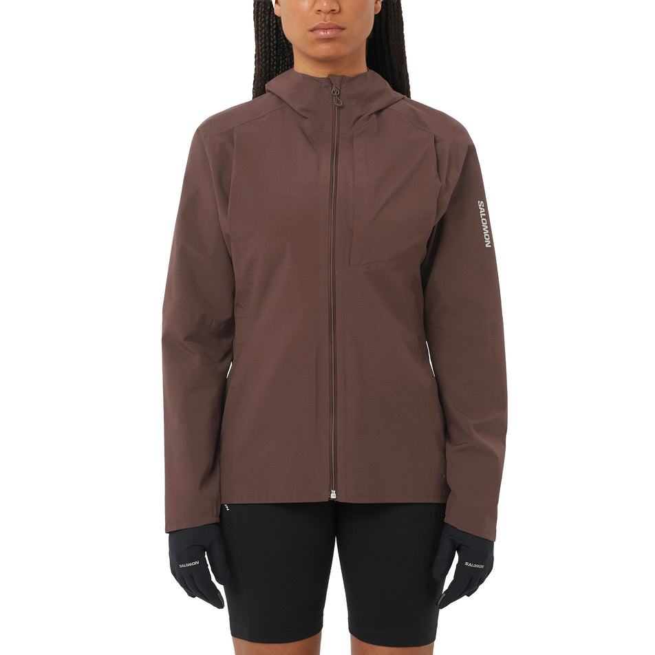 Front view of a model wearing the Salomon Women's Bonatti Trail Shell Jacket in the Coffee Bean colourway. (8726944186530)