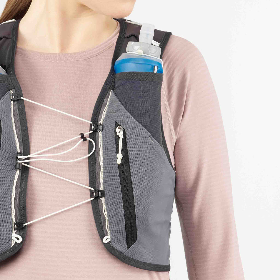 Close-up view of one of the soft flasks that come with the Salomon Unisex ADV Skin 12 Gradient Running Vest with flasks included in the Phantom/Castlerock/Icicle colourway. (8737327317154)