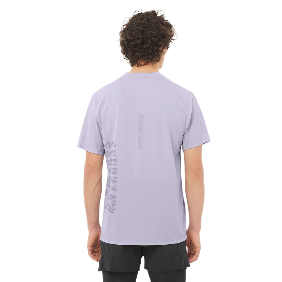 Back view of a model wearing the Salomon Men's Salomon Sense Aero Graphic Short Sleeve T-Shirt in the Cosmic Sky/Castlerock colourway. (8577957068962)