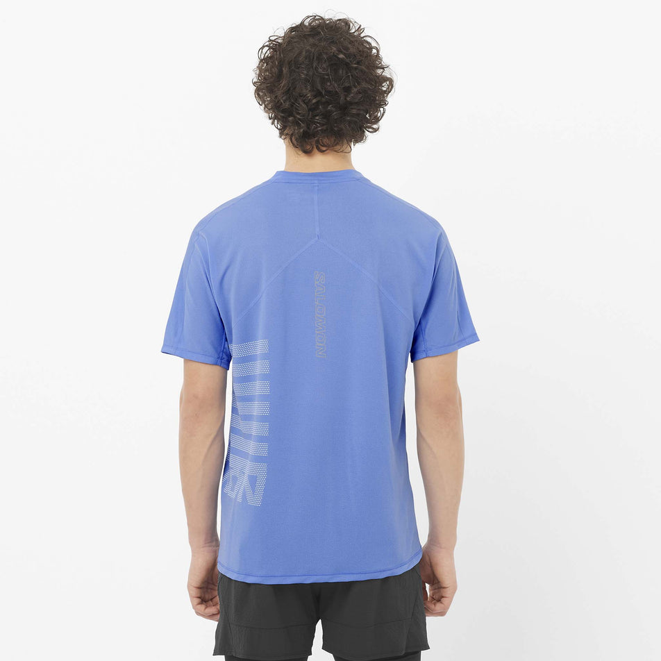 Back view of a model wearing the Salomon Men's Sense Aero Graphic Short Sleeve T-Shirt in the Ultramarine/White colourway. (8577960771746)