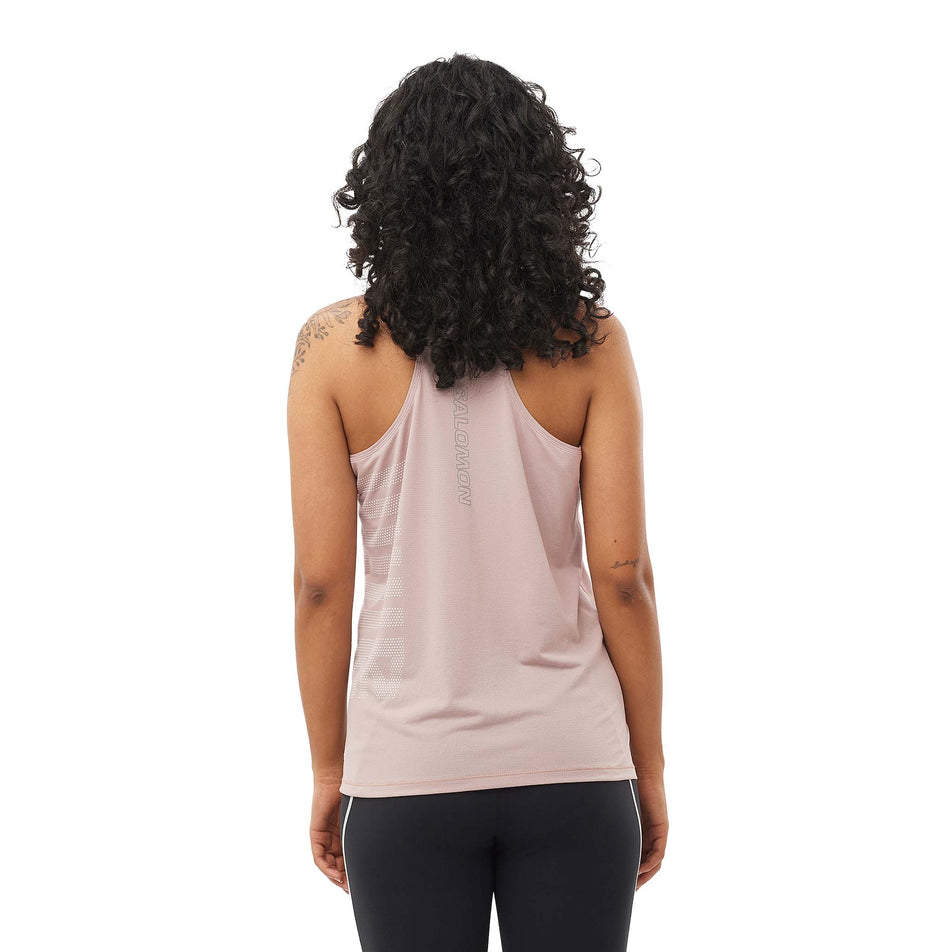 Back view of a model wearing the Salomon Women's Sense Aero Graphic Tank in the Etherea/White colourway. (8577406009506)