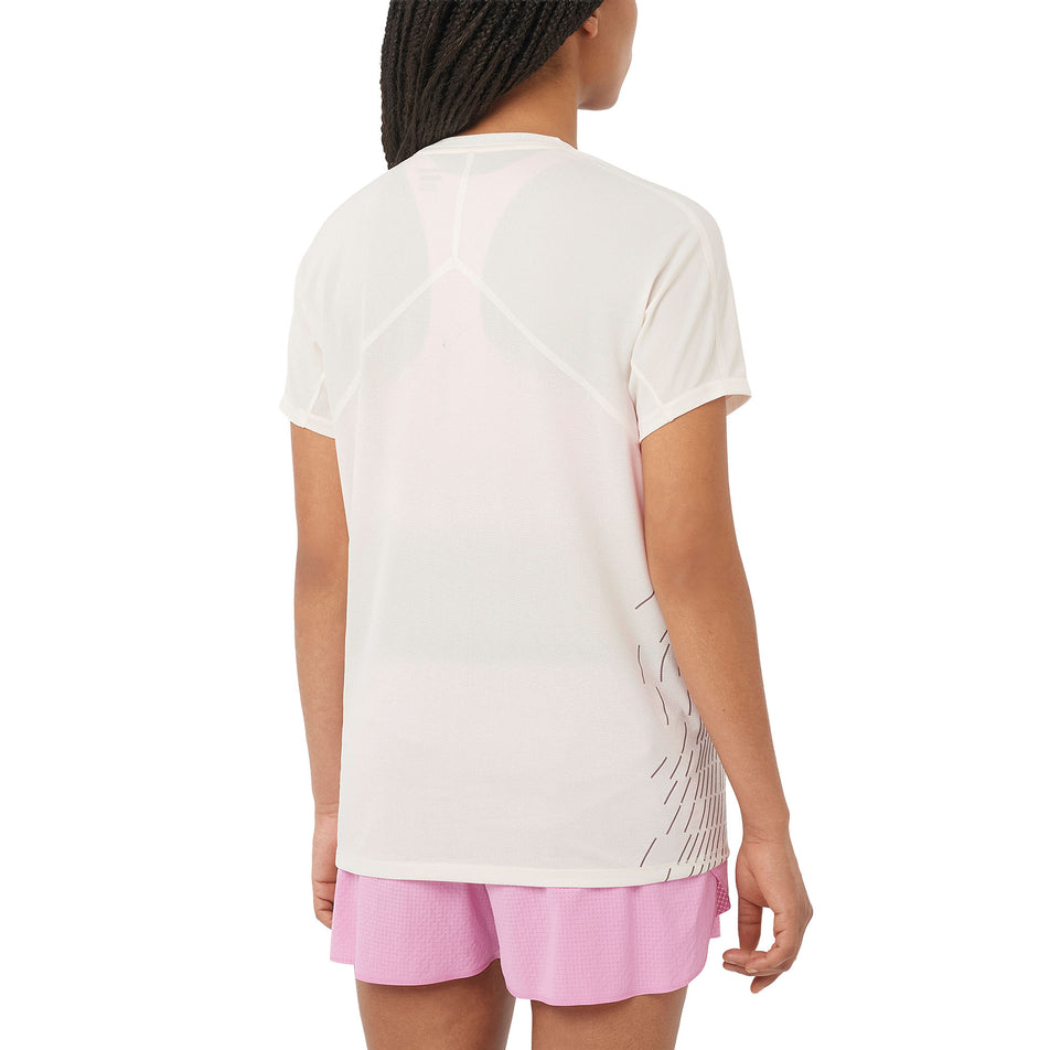 Back view of a model wearing the Salomon Women's Sense Aero Graphic Short Sleeve T-Shirt in the Whisper White/White colourway. (8727016571042)