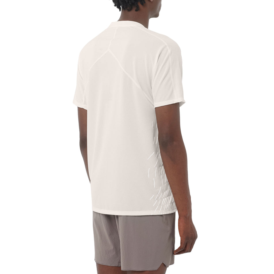 Back view of a model wearing the Salomon Men's Sense Aero Graphic Short Sleeve T-Shirt in the Whisper White/White colourway. (8736777601186)