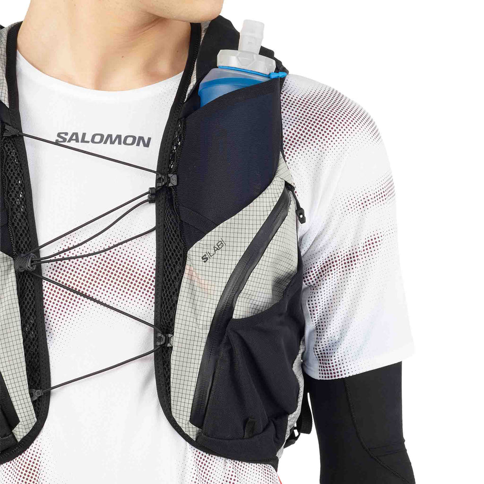Close-up view of the soft flask on the front of the Salomon Unisex S/LAB Adventure 20 Running Vest with flasks included in the Black/White colourway. (8737335279778)