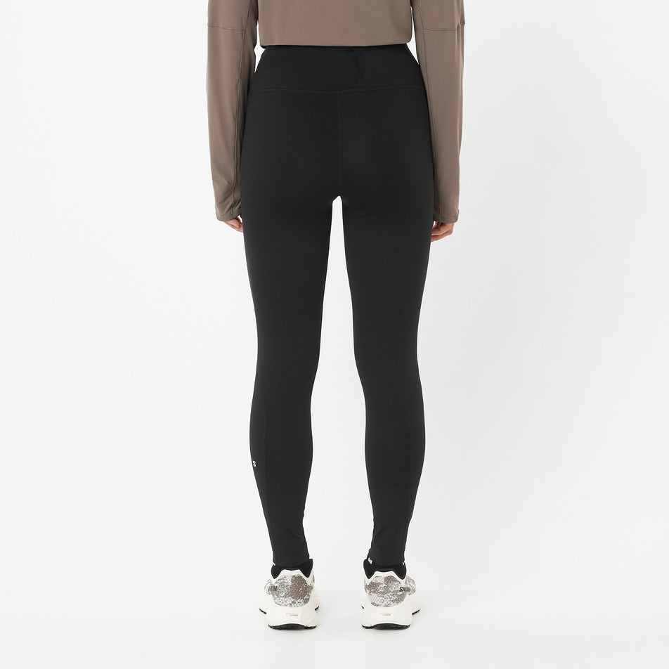 Back view of a model wearing the Salomon Women's Shakeout Core Tights 26