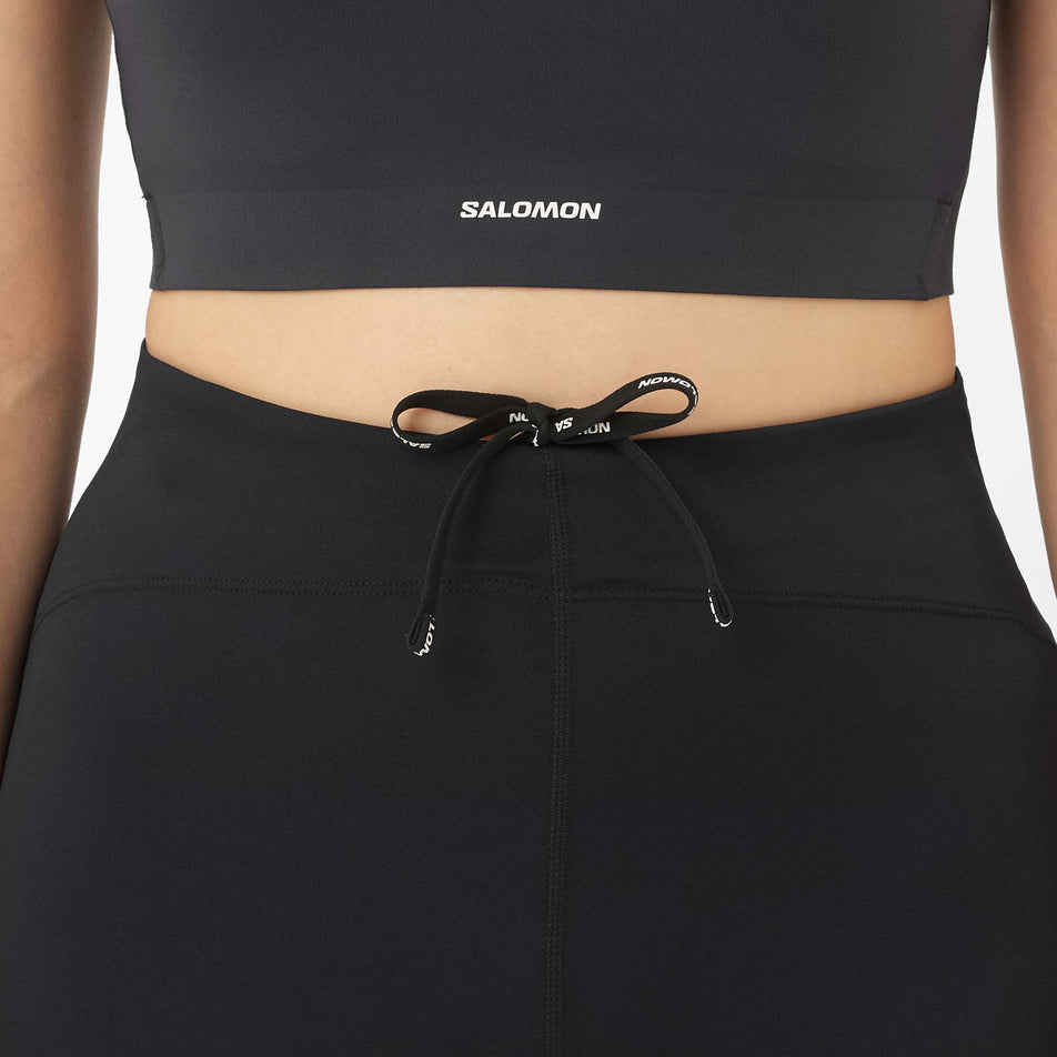 Front view of a model wearing the Salomon Women's Shakeout Core Tights 26