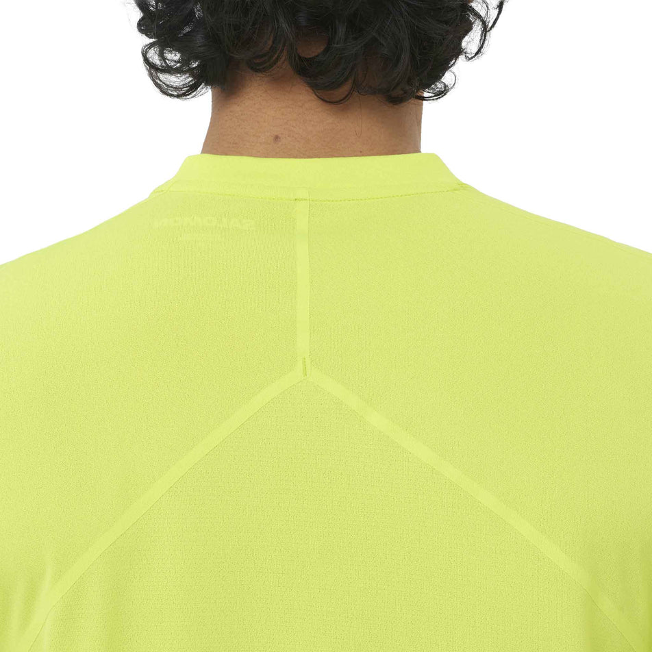 Back view of a model wearing the Salomon Men's Sense Aero SS Tee GFX in the Acid Lime/Butterfly colourway.