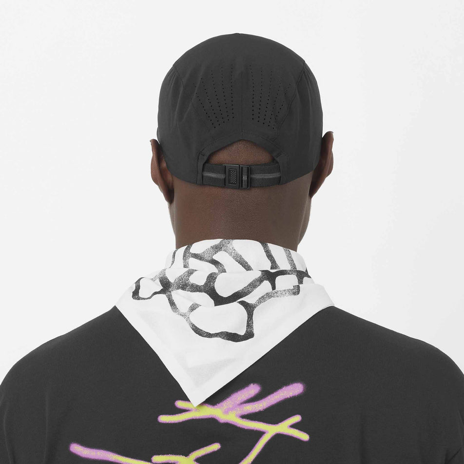 Back view of a model wearing the Salomon Unisex Shakeout Cap in the Deep Black colourway.