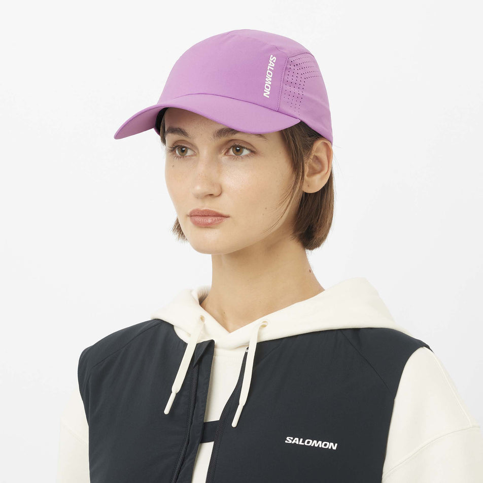 Front view of a model wearing the Salomon Unisex Shakeout Cap in the Iris Orchid colourway.