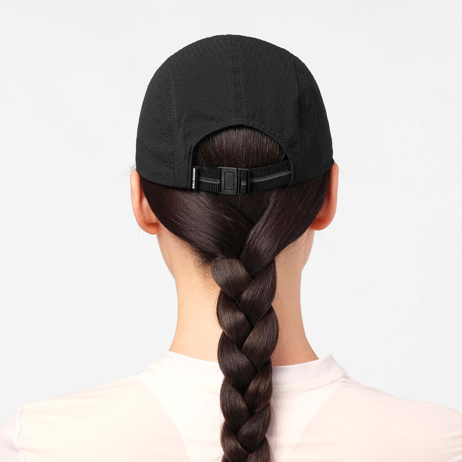 Back view of a model wearing the Salomon Unisex S/LAB Ultra Summer Cap in the Deep Black colourway.
