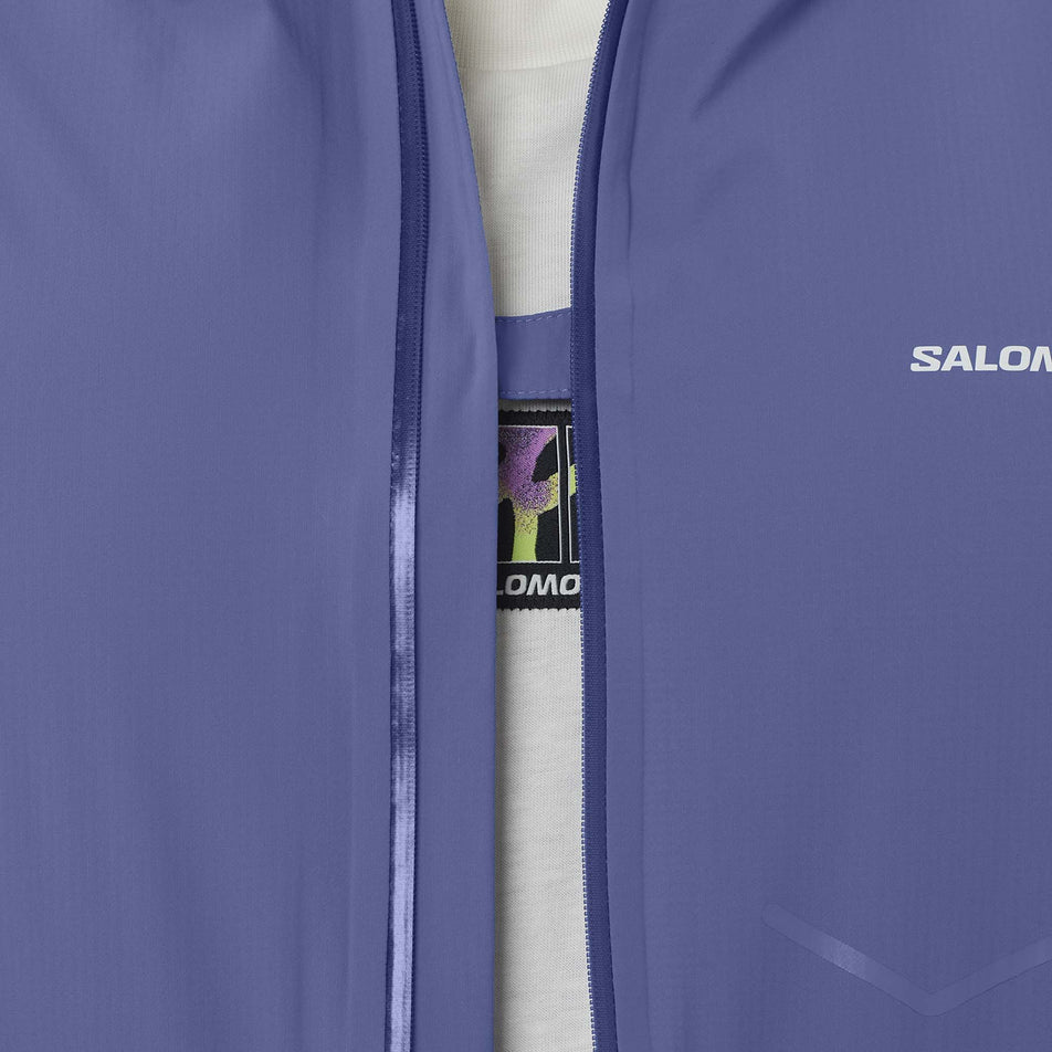 Front view of a model wearing the Salomon Men's Bonatti Waterproof Shell Jacket in the Marlin colourway.