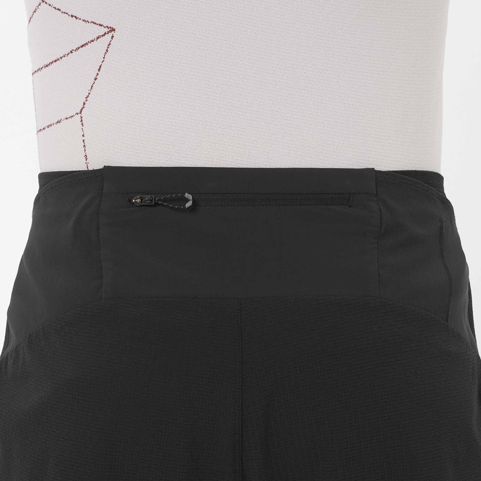 Back view of a model wearing the Salomon Men's Sense Aero Stow 5