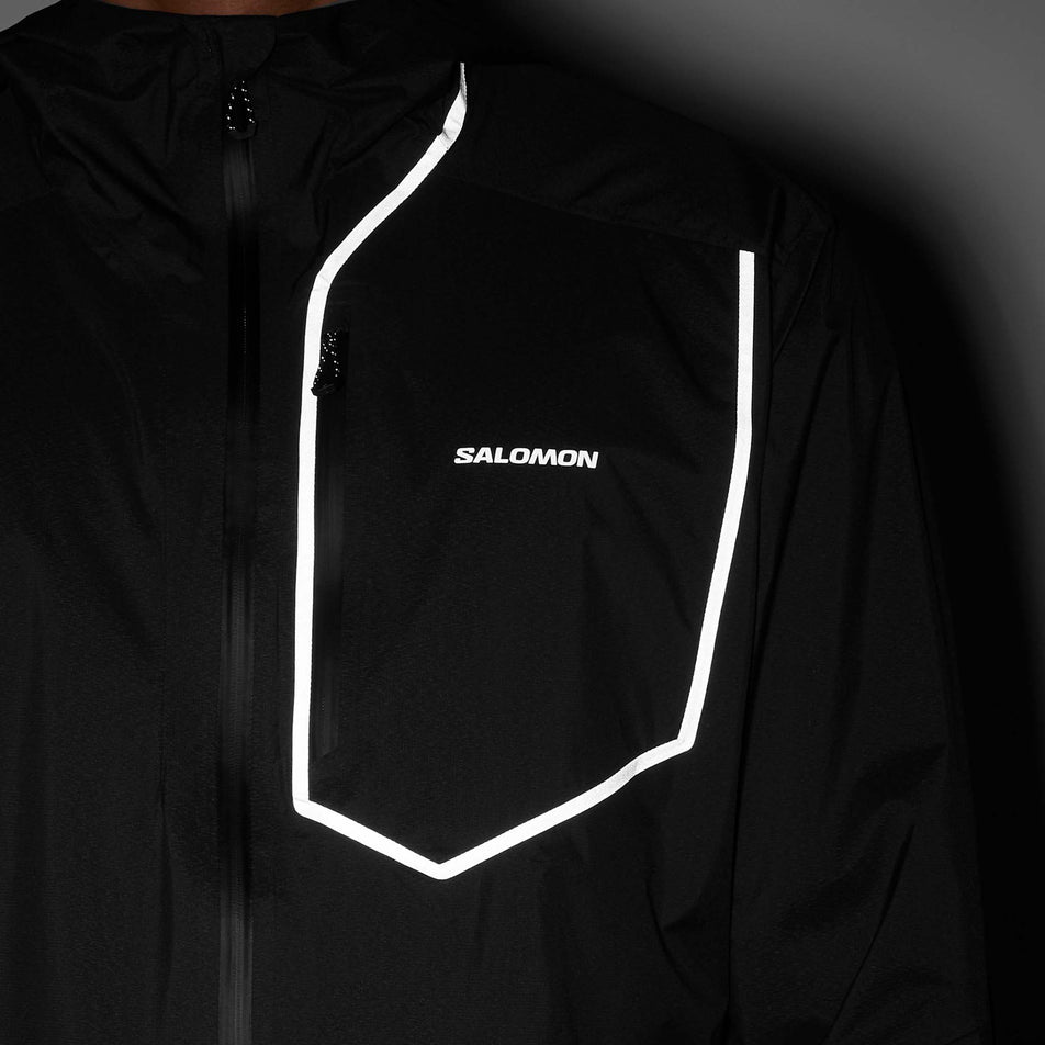 Front view of a model wearing the Salomon Men's Bonatti Pro Shell Jacket in the Deep Black colourway.
