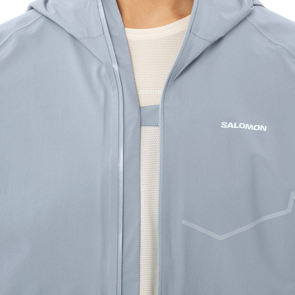 Front view of a model wearing the Salomon Women's Bonatti Waterproof Jacket in the Trade Winds colourway.