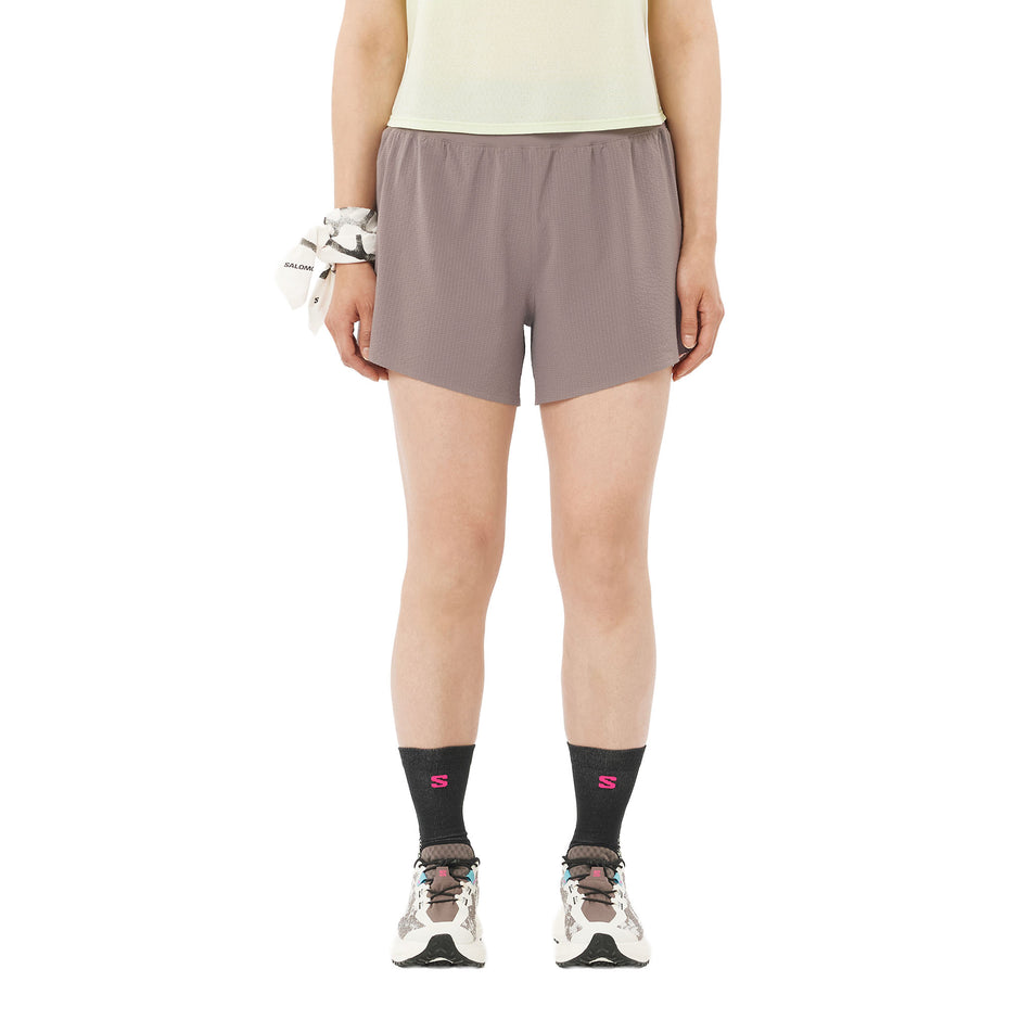 Front view of a model wearing the Salomon Women's Sense Aero Stow 4