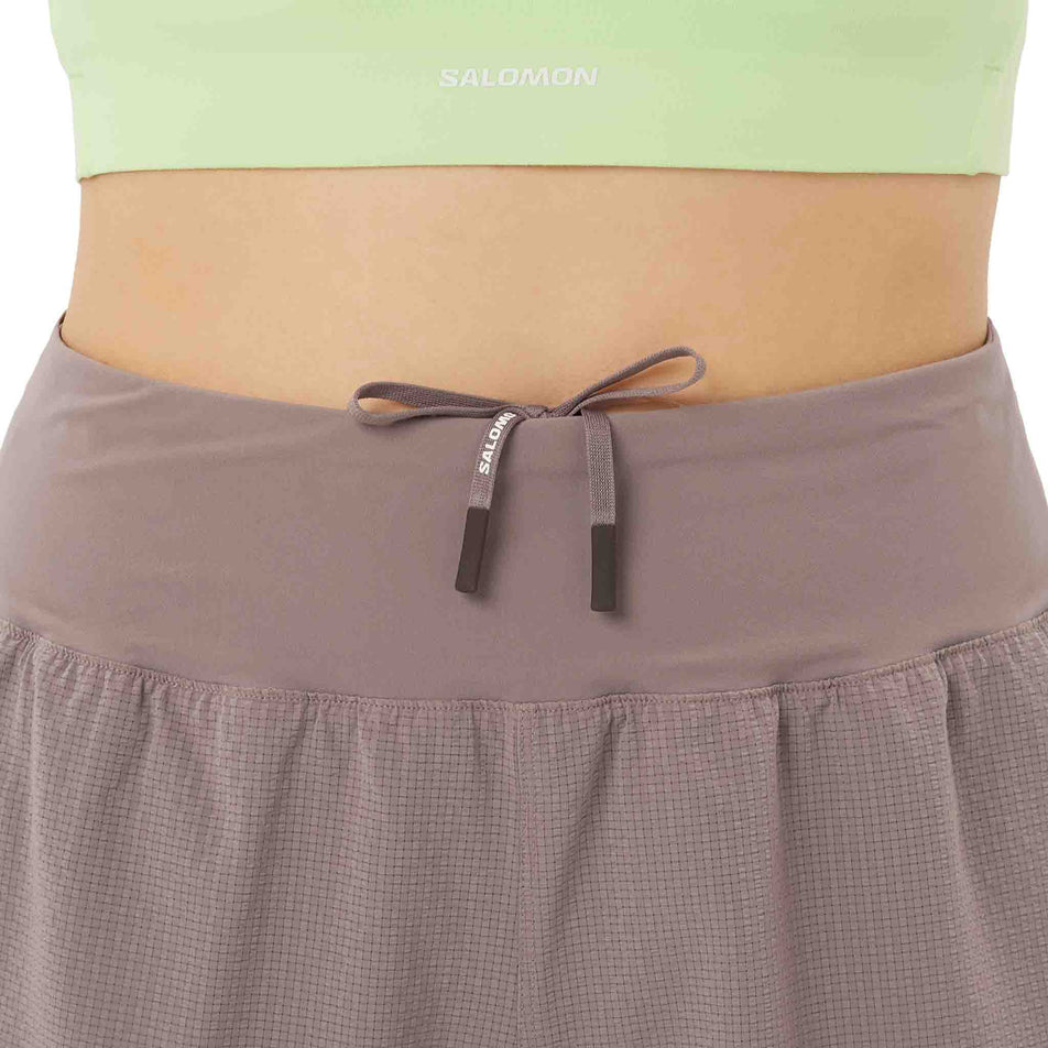 Front view of a model wearing the Salomon Women's Sense Aero Stow 4
