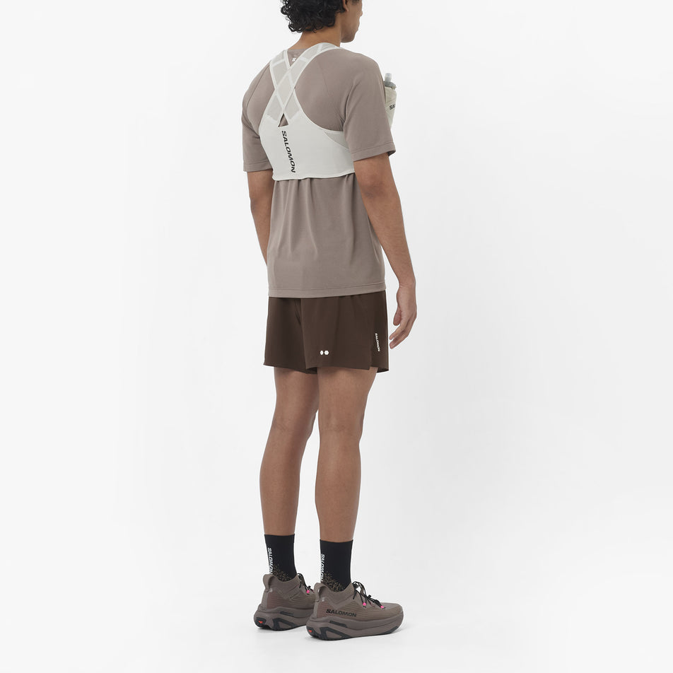 Back view of a model wearing the Salomon Men's Shakeout Core Short-Sleeve T-Shirt in the Iron colourway.