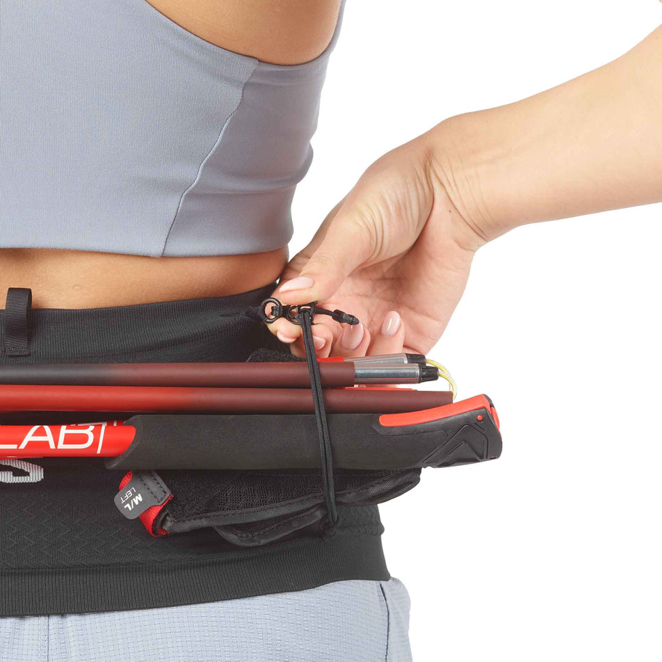 Close-up view of the storage loops on Salomon Unisex ADV Skin Seamless Belt in the Black/White colourway.