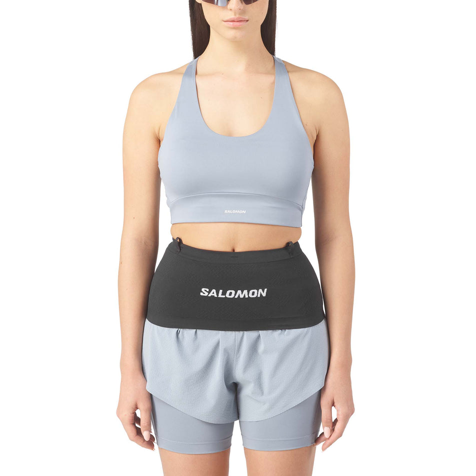 Front view of a model wearing the Salomon Unisex ADV Skin Seamless Belt in the Black/White colourway.