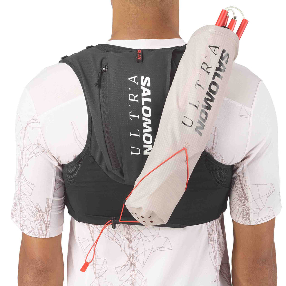 A Salomon quiver with running poles attached to the Salomon Unisex S/LAB Ultra 12 Running Vest in the Black colourway.