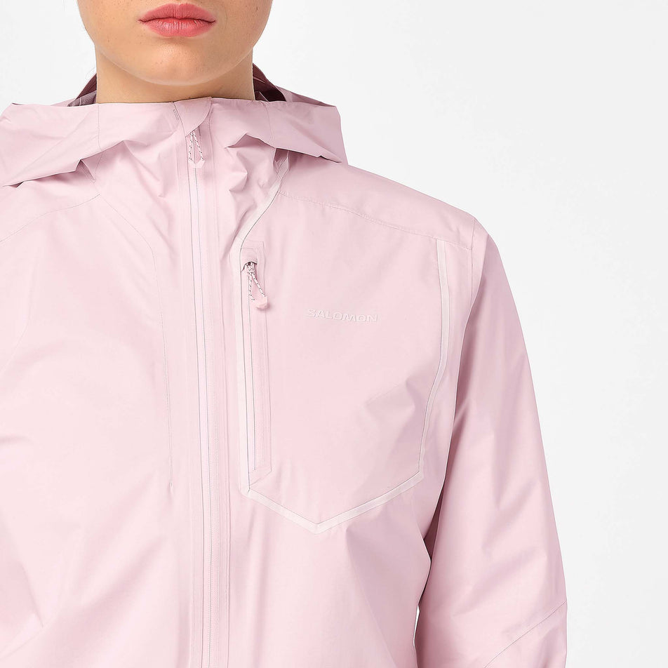 Front view of a model wearing the Salomon Women's Bonatti Pro Shell Jacket in the Icy Pink colourway.